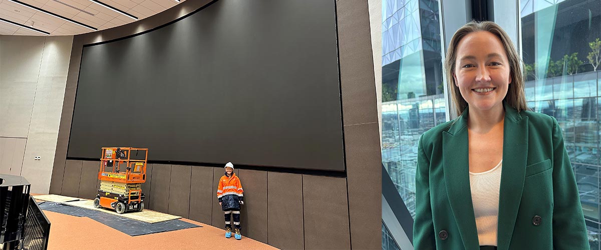 A woman stands in front of a large screen under construction. On the right of the image is a headshot of a woman.